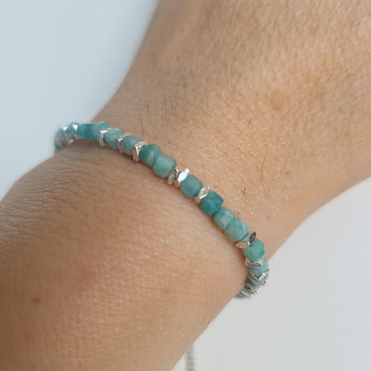 Amazonite, adjustable bracelet on a wrist against a white background