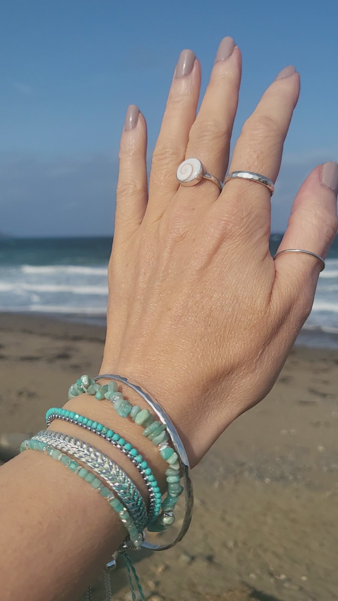 8 piece, bracelet and ring set, hammered silver and gemstone, ocean background